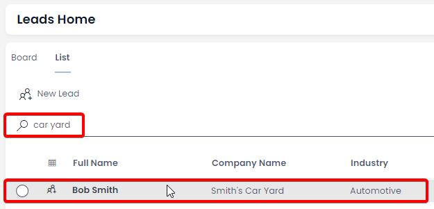 A screenshot demonstrating how the user can open a Lead item. The screenshot depicts the Leads data table. The screenshot is annotated with two red boxes: the first one indicates that the user has searched for the phrase &quot;car yard&quot;, to filter the table results to only show items that contain this phrase in their searchable columns. The second red box highlights an item row that the user is hovering over.